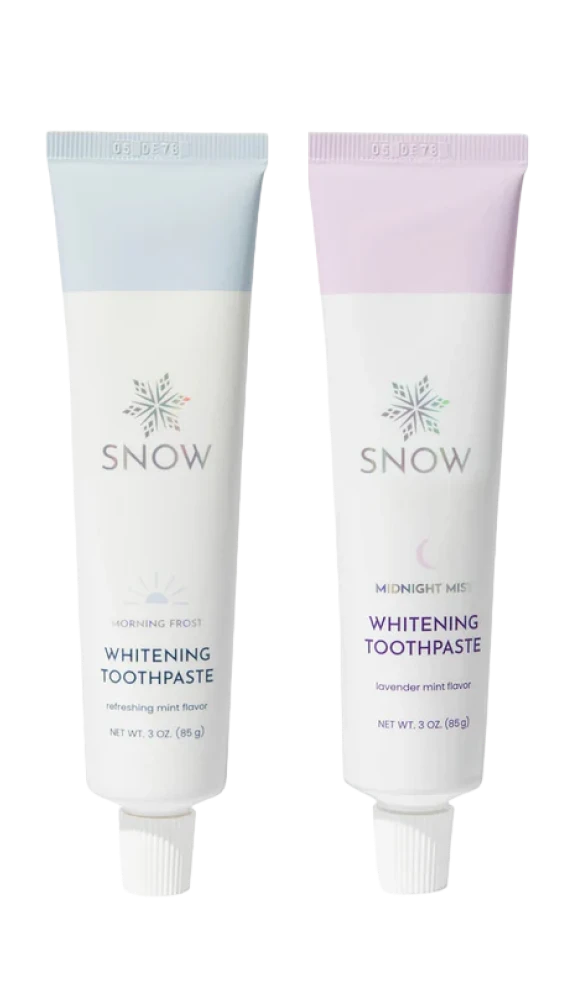 Two tubes of Snow whitening toothpaste, 'Morning Frost' and 'Midnight Mist.'