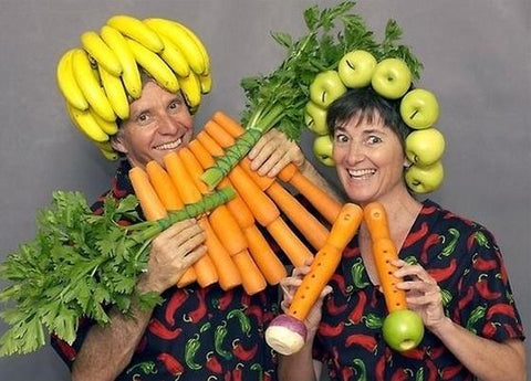 Couple with vegetables mocked into musical instruments