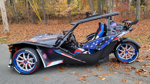 Polaris Slingshot with color matched red, white, and blue wheels