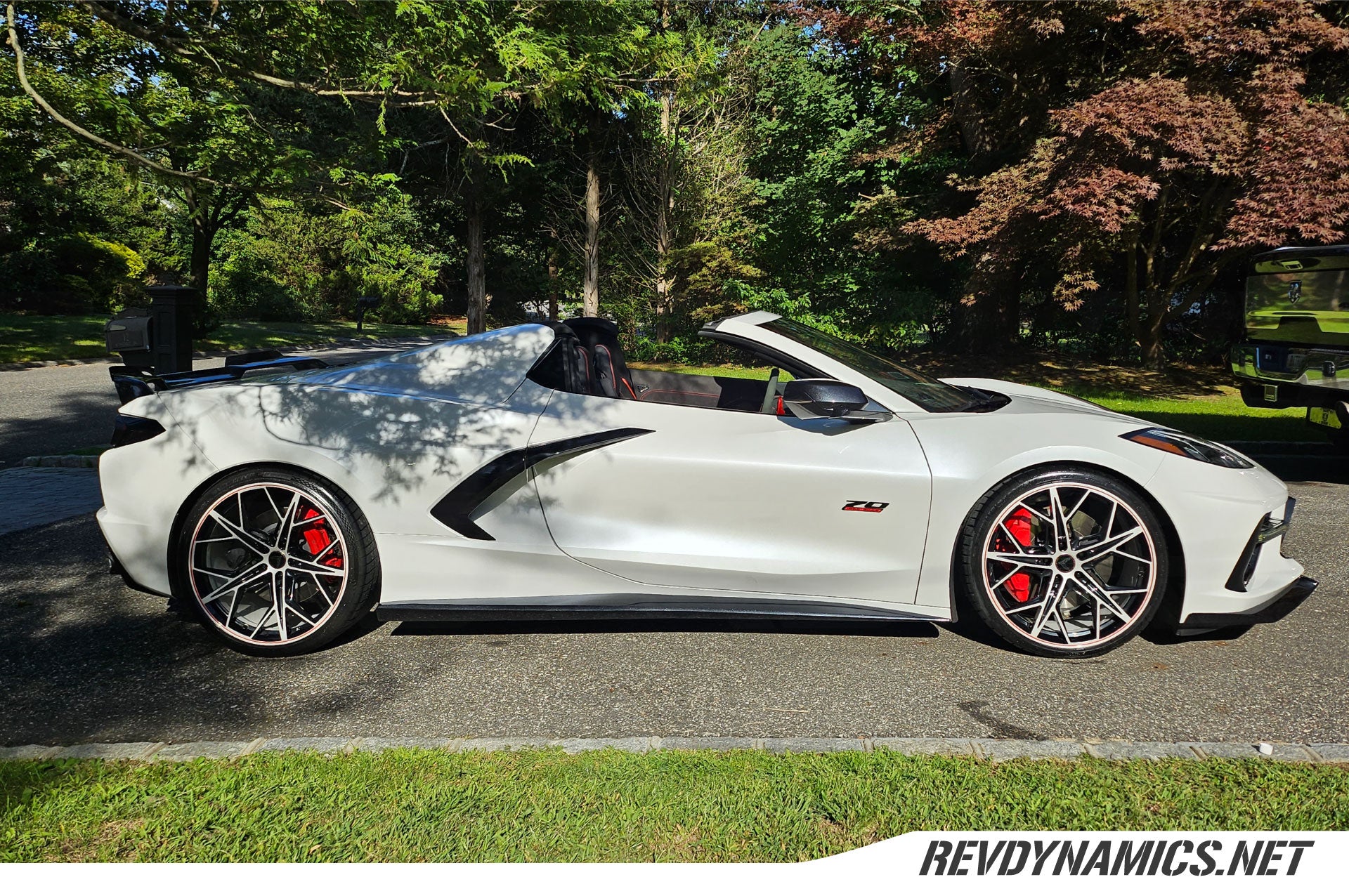 70th Anniversary Corvette C8 with custom wheels in arctic white, carbon flash, and torch red pinstripe