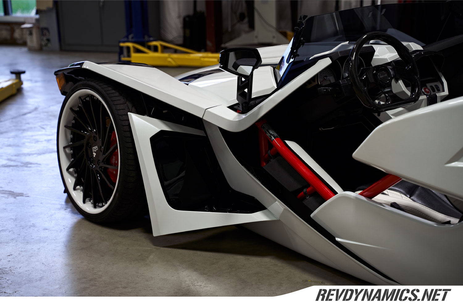 Polaris Slingshot Custom Wheels and two toned pearl white and gloss black fender