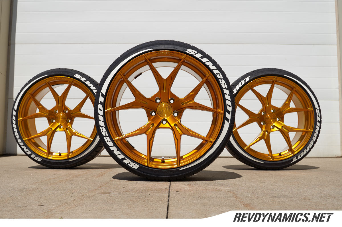Gold wheel with white tredwear tire lettering