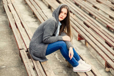 girl wearing cardigan and jeans
