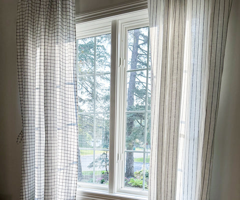 Linen Curtains drawn open to allow natural light, illustrating the flexible light control provided by curtains in interior spaces.