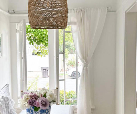 Linen curtains enhancing natural light and ambiance in a modern space.