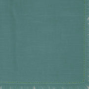 Alt Text: Turquoise cotton fringe napkins, vibrant 100% cotton napkins with frayed edges, durable, washable, and perfect for coastal or summer-themed tables.