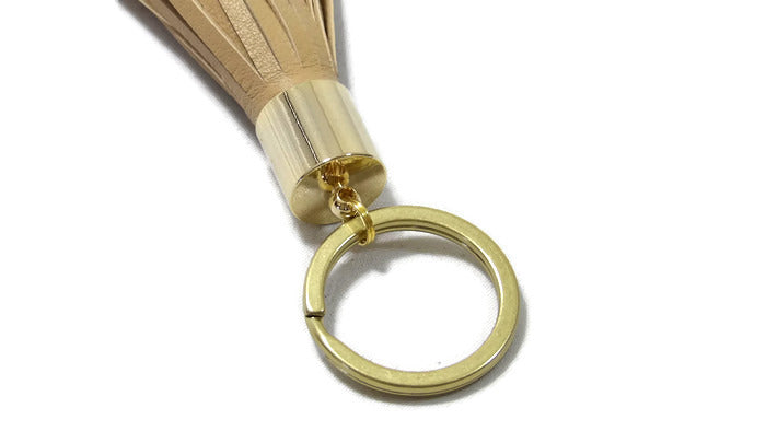 Creative Co-op Brass Key Chain with Saying and Leather Tassel