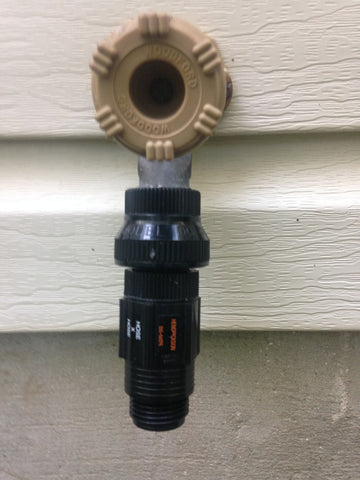 Backflow preventer and pressure regulator on hose bib