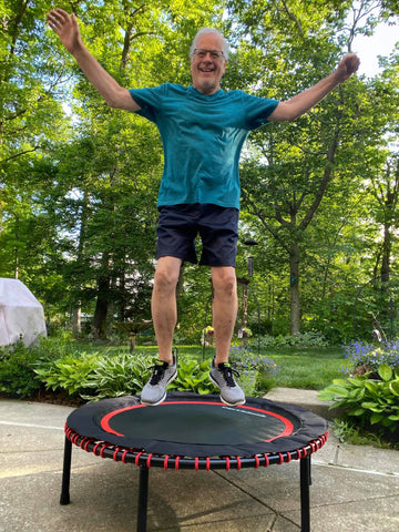 old man jumping on rebounder