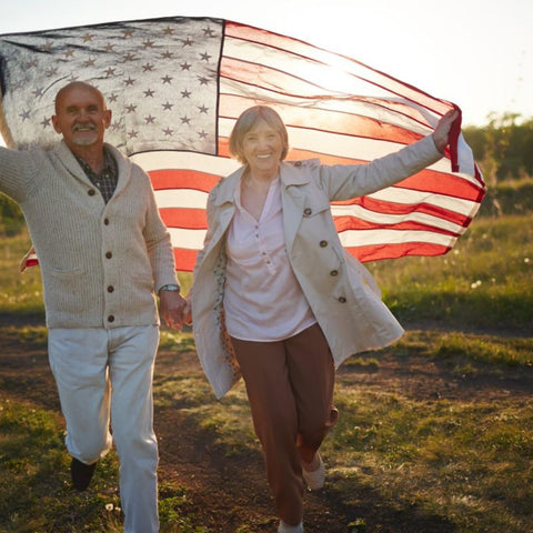 elderly with arthritis and flag