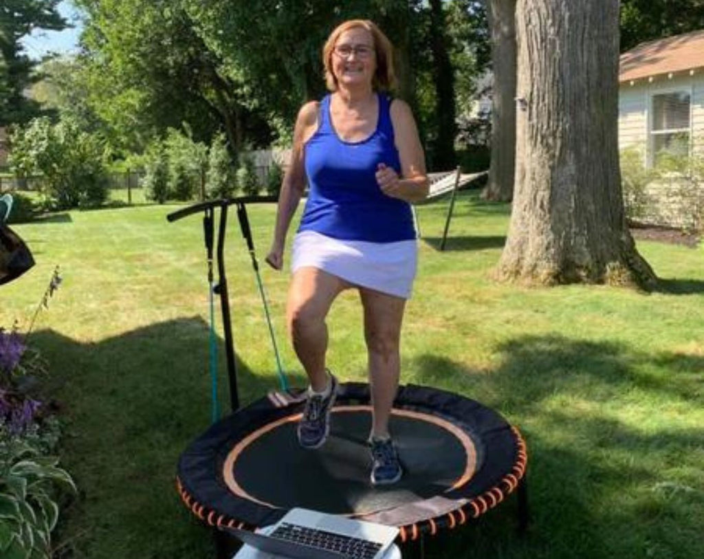 old lady bounces on rebounder