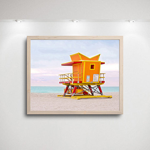 art print orange lifeguard tower on beach with simple frame and lighting