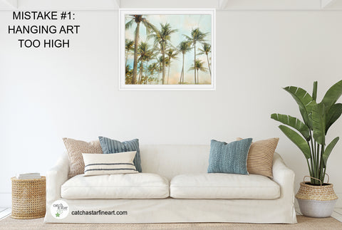 Are you making these 8 mistakes with your wall art?  Check out our free ebook with home decor tips to make your walls the best they can be! Hint: Number ONE is the most common mistake! #homedecor #howtohangart #howtohangartonwall #howtohangartabovesofa