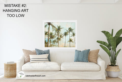 Are you making these 8 mistakes with your wall art?  Check out our free ebook with home decor tips to make your walls the best they can be! Hint: Number ONE is the most common mistake! #homedecor #howtohangart #howtohangartonwall #howtohangartabovesofa