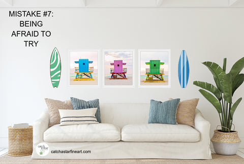 A tropical living room with colorful lifeguard tower photos and surfboards on the wall.