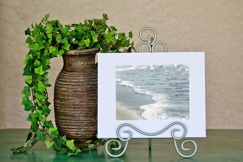 abstract shoreline photograph with a white mat displayed in an easel