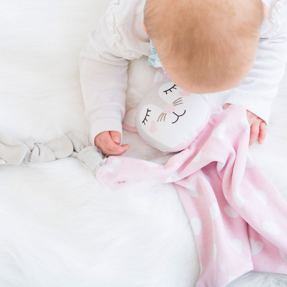 baby holding bed