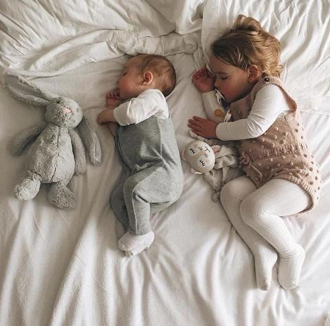 Siblings with Kippy Kippin baby comforter