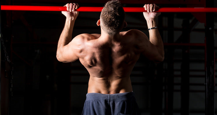 man performs chin-ups