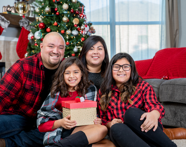 Family sitting in living room