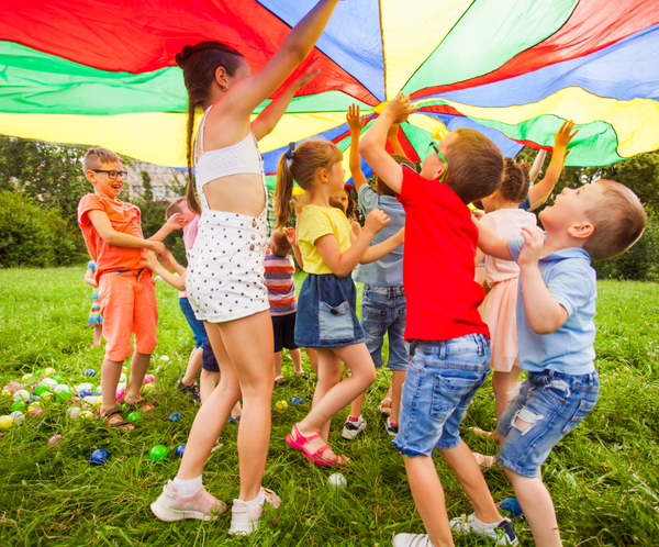 Kid's playing under parachute