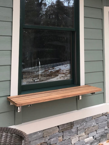 Custom Shelf with our folding brackets used outside under a window. This provides the customer with a shelf that can be folded out of the way, but lifted up when needed.