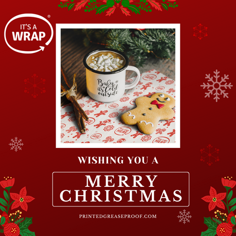 Merry Christmas from It's a Wrap. Image features a gingerbread man and a cup of hot chocolate sitting on a piece of branded greaseproof paper printed in a red "ho-ho-ho" design.