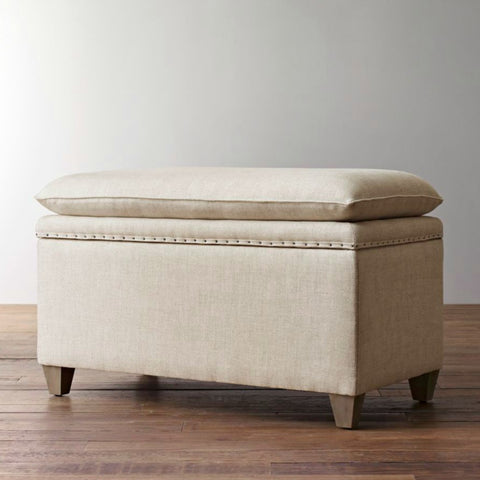 beige upholstered storage bench to declutter the house and store toys