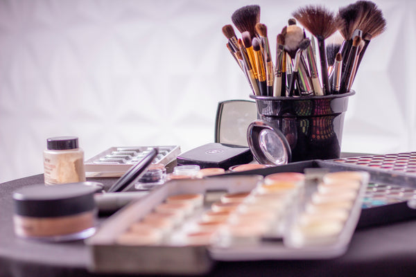 Best Mineral Makeup: Makeup brushes and palettes on a counter