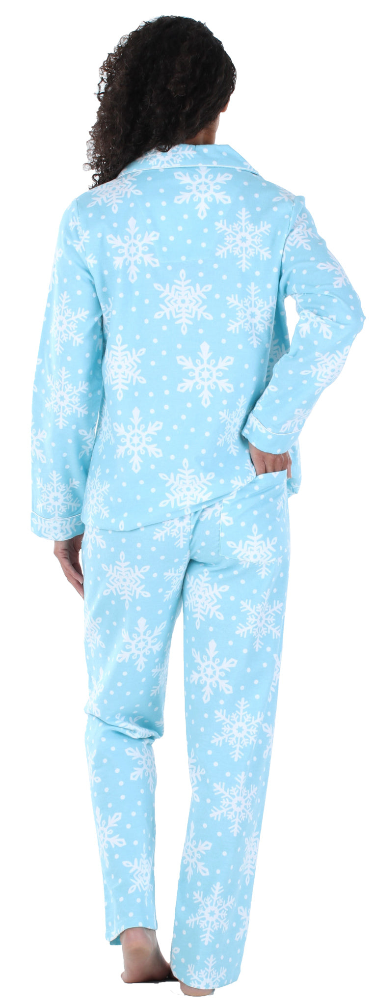 The rear view of a woman wearing pajamas. Fabric is Flannel and the print is Icy Snowflakes