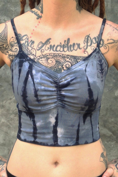 Front view of Sodalite tie dye Blissed Out crop tank with adjustable spaghetti straps and scrunched center puckering between the breasts. Steel blue with black streaks and white highlights. 