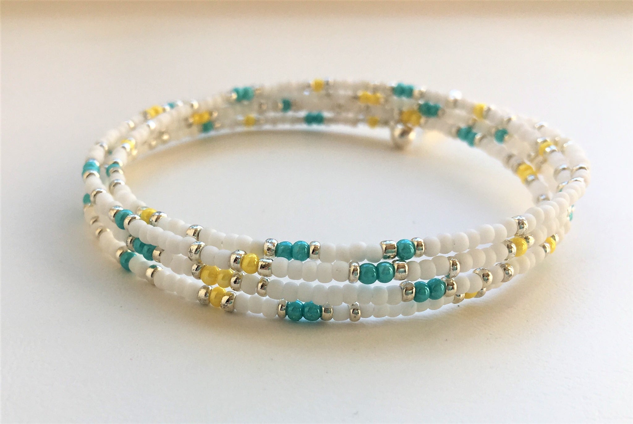 Beaded memory wire bracelet - white, turquoise, yellow and silver beads ...