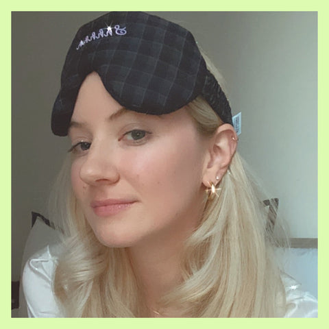 Olivia White the Co-founder and CEO of 41 Winks wears a plush black sleep mask as she gets ready for bed