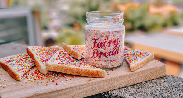 Fairy Bread candle with pieces of fairy bread around it