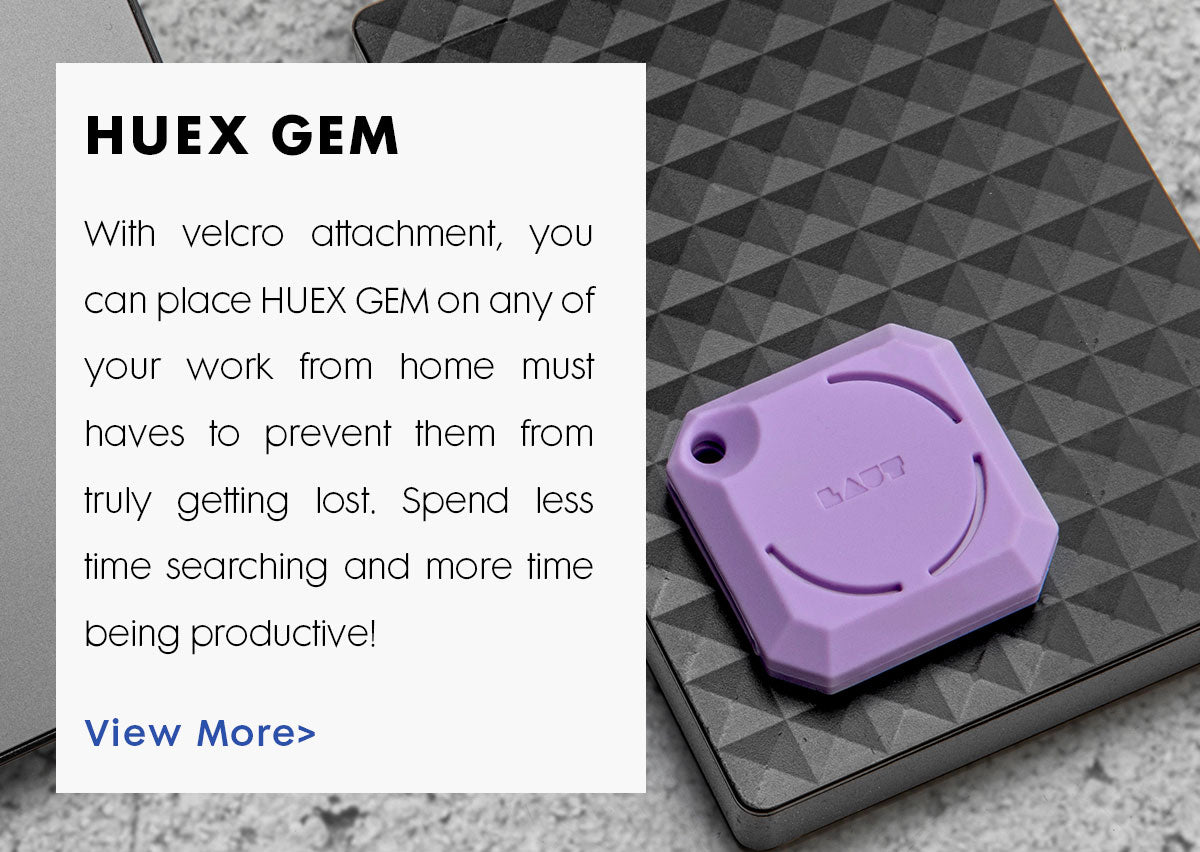 Title reads: HUEX GEM. Text reads: With velcro attachment, you can place HUEX GEM on any of your work from home must haves to prevent them from truly getting lost. Spend less time searching and more time being productive! A photo in the background shows a purple HUEX GEM AirTag holder that has been attached to a black textured surface. 