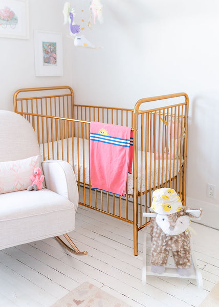 Gold baby crib from Babyletto