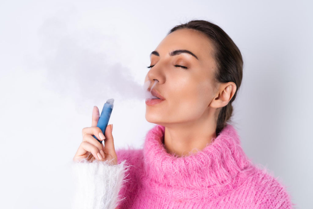 women vaping with eyes closed