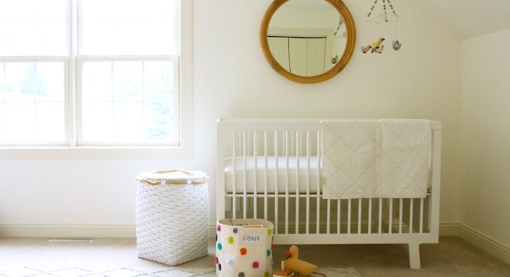 colorful basket and toy duck in neutral nursery