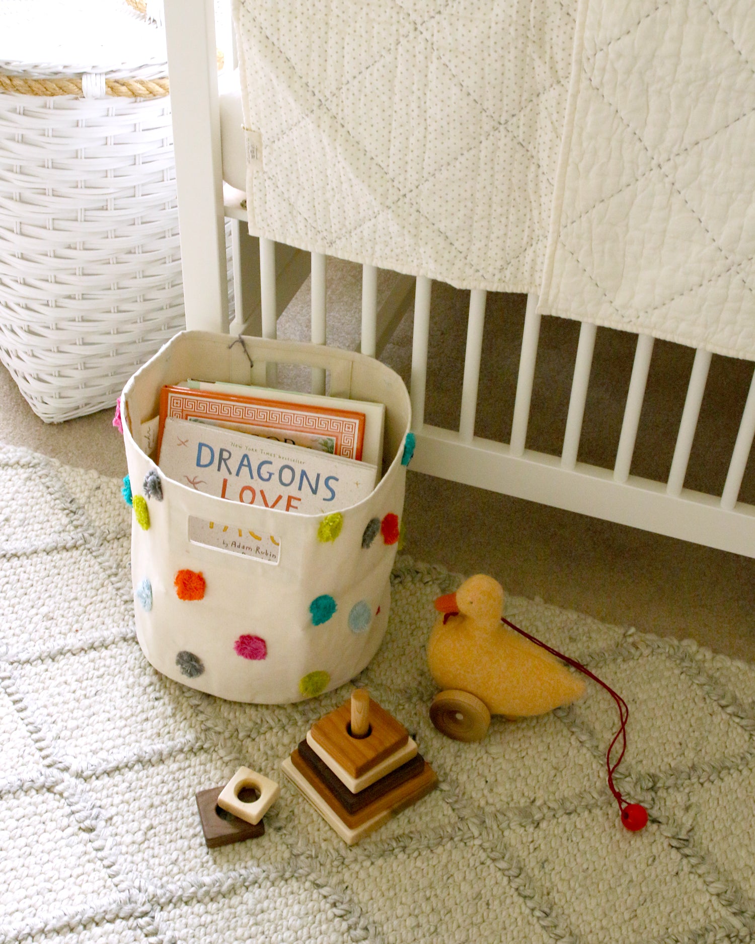 books, wood toy and duck in neutral nursery