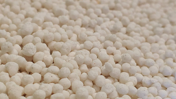 Tiny balls of chemical fertilizer, which can contain ureas and other common soap ingredients.