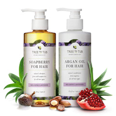 Hydrating Shampoo and Conditioner pump bottles in Lavender, around it are aloe vera, soapberry, pomegranate and argan oil garnishes