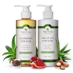 Soothing Shampoo & Conditioner in Peppermint Scent pump bottle, around it are opened Pomegranate, Soapberry, Aloe Vera and Argan Oil.