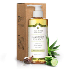 Unscented Ultra Gentle Body Wash pump bottle in front of its kraft box, with Soapberry nut, Aloe Vera, and Cucumber around it