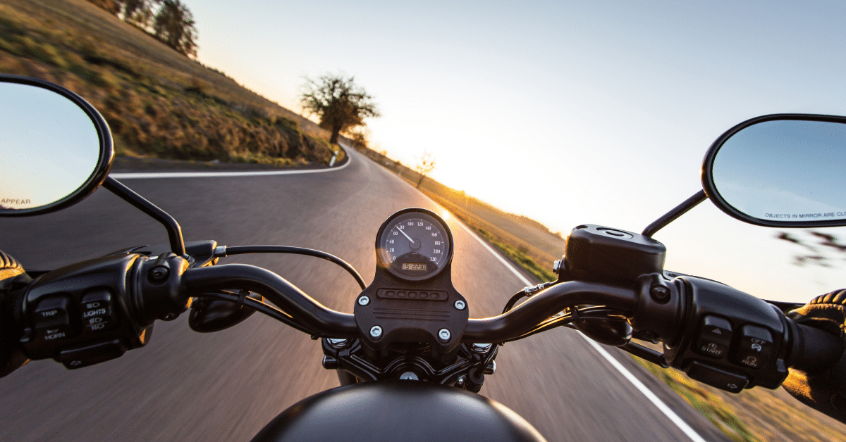 View from a motorcycle driving to a curve road