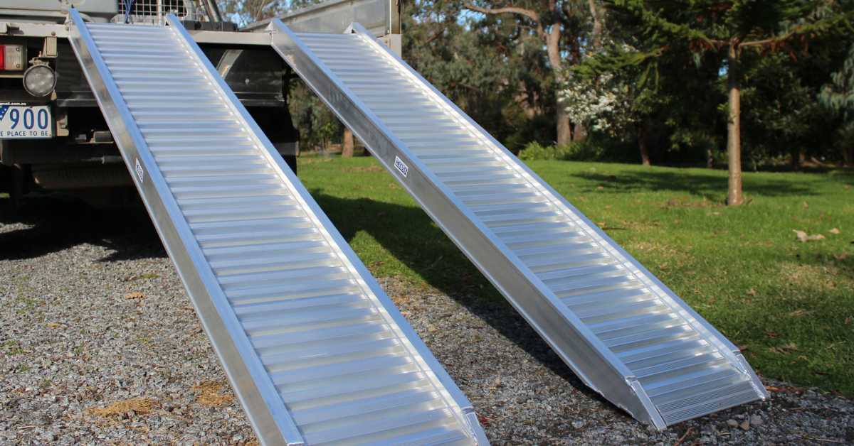 Image of the Heeve 2.5-Tonne 2.3m x 380mm Aluminium Loading Ramps on the rear of a ute