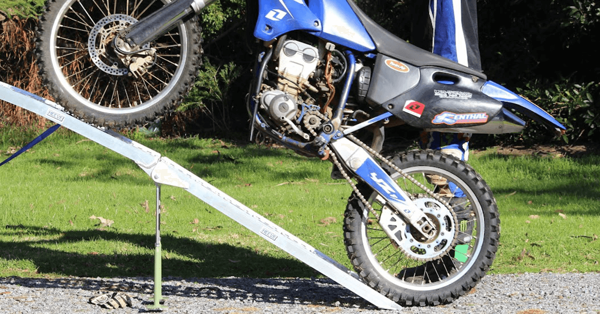 Actual loading of a motorcycle on ramp to show the weight capacity of ramp