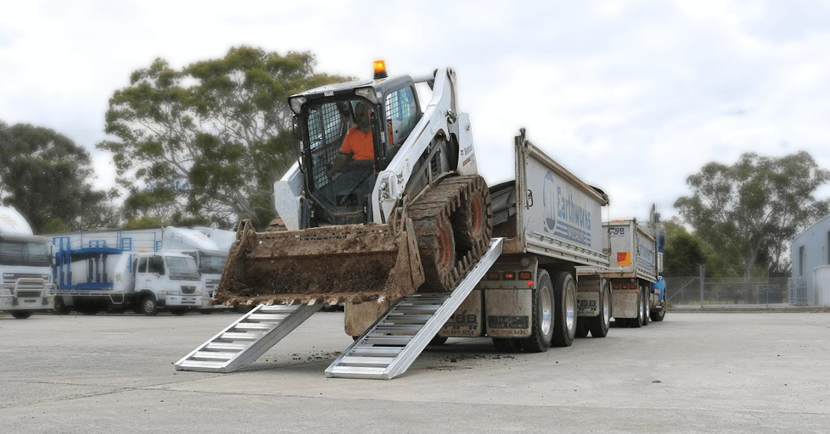 skid-steer-loader-loaded-properly-using-the-loading-ramp