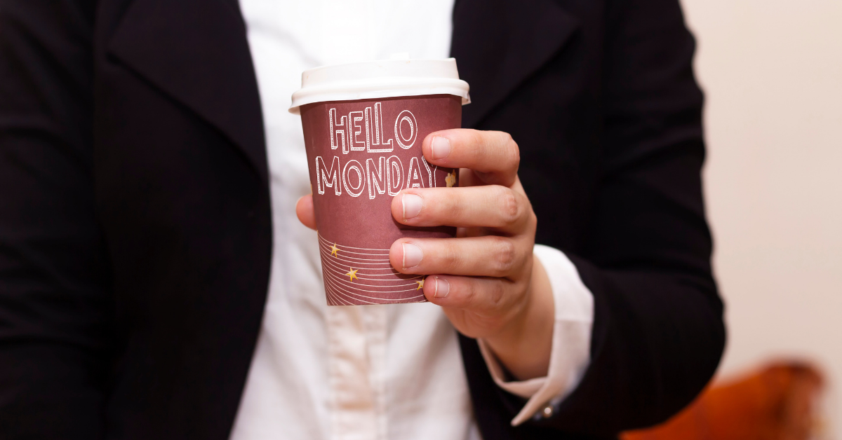 Man in suite holding a cup of coffee with hello Monday text to show how coffee and Monday matches like driveways and kerb ramps