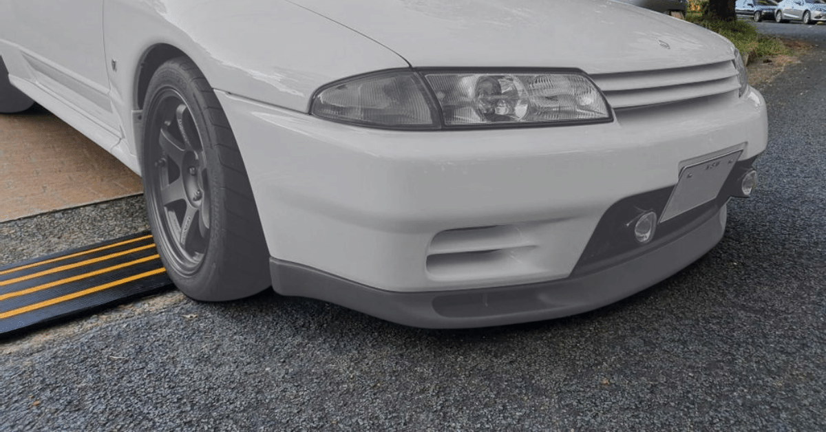 car driving off the driveway with driveway kerb ramps