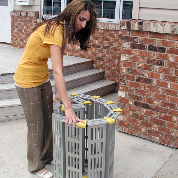 Woman setting up a roll-a-ramp ramp